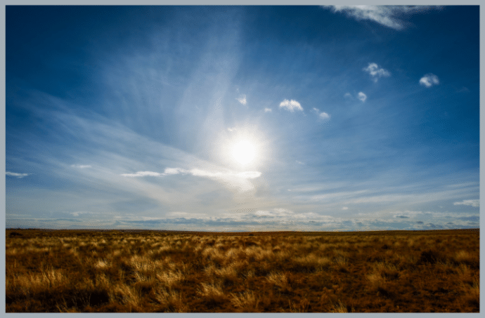 Colorado prairie grasslands with sun in the sky