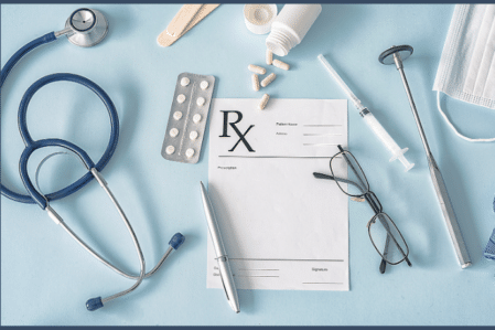 Prescription pad, stethoscope, pen and glasses