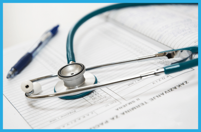 Stethoscope, pen and medical chart