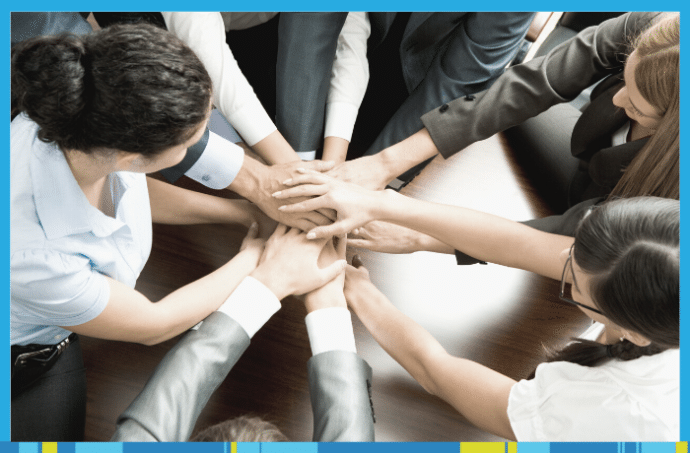 Group of hands supporting one another